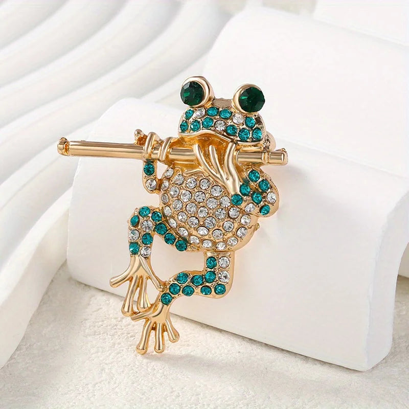 The Piping Frog Brooch, close-up
