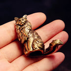 Maisie the Maine Coon bronze figurine held in the hand