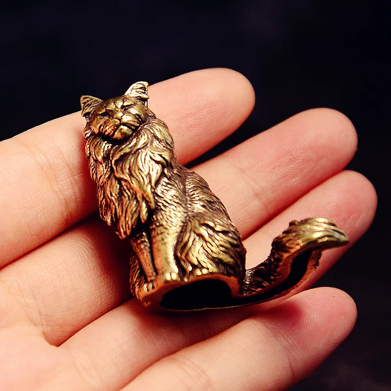 Maisie the Maine Coon bronze figurine held in the hand