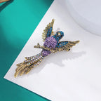 The Bird of Paradise Brooch on teal and white