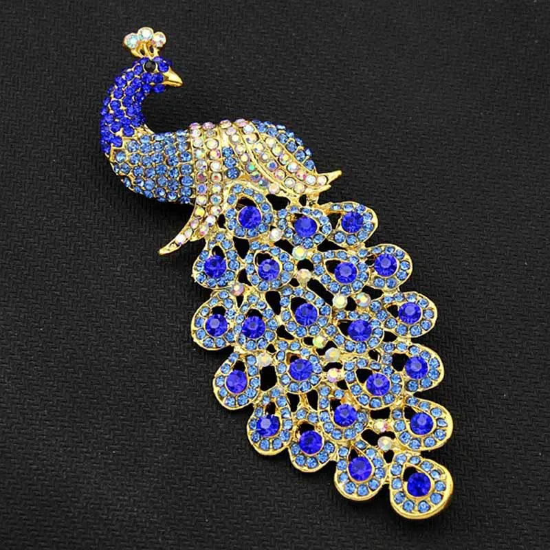 The Sapphire Peacock Brooch on a dark background