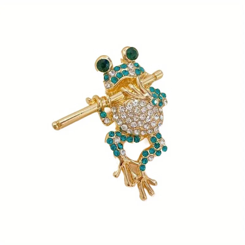 The Piping Frog Brooch on a white background