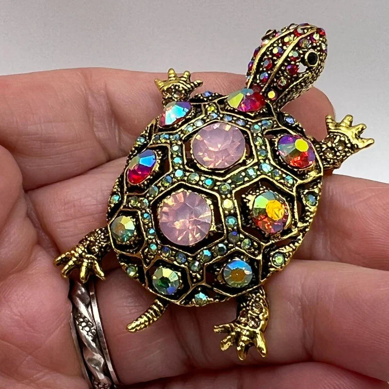 The Treasure Tortoise Brooch held in the hand