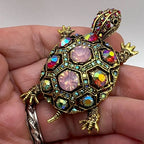 The Treasure Tortoise Brooch held in the hand