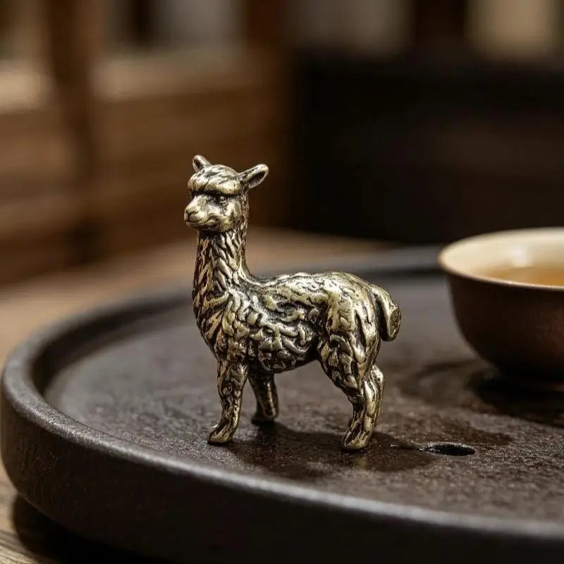 Alfie the Alpaca bronze figurine on a tea tray
