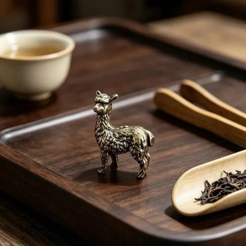Alfie the Alpaca bronze figurine with tea tools